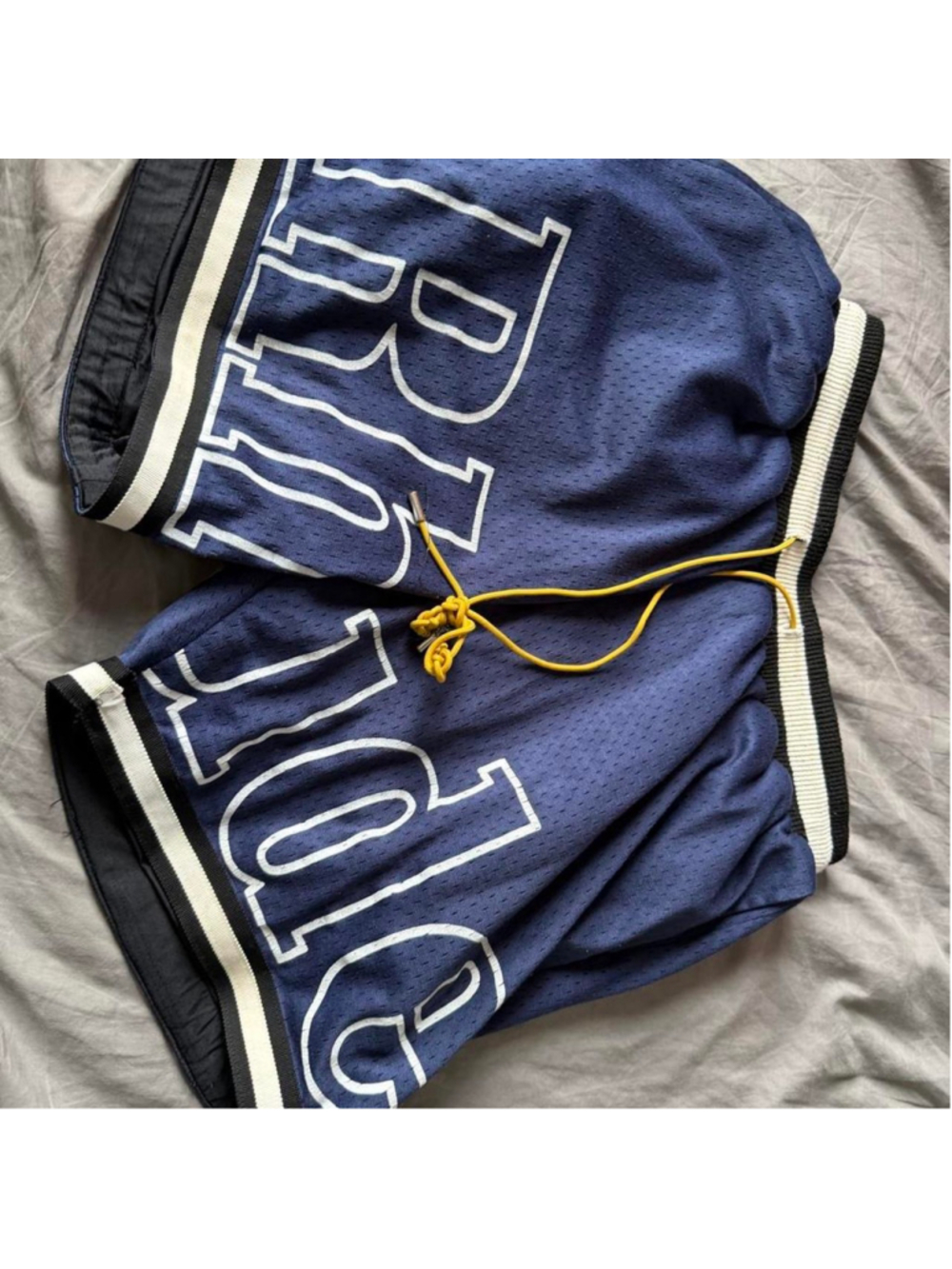 Rhude blue shorts with white lettering spelling 'RHUDE ' and white/black trim, s
